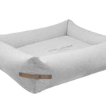 Gray pet bed with a brand logo on a white background
