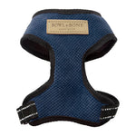 Blue dog harness with 'Bowl & Bone' label on a white background