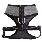 Black and gray dog harness on a white background